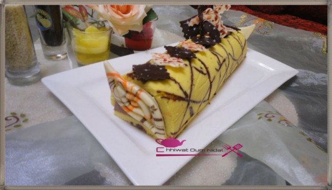 buche imprimée, imprimee, cake roulé, roulee, génoise, cigarette, pate, chocolat, cacao, crèma patissière, creme, poudre amande, biscuit jocande, boudoires, recette, cuisine marocaine, bonne année, nouvelle année, chhiwate cuisine oum nidal, كيك ملفوف, رولي, وصفة, كاطو, جينوازو جينواز, لوز, شهيوات مغربية, حلويات, أطباق حلوة, كريمة حلوانية, مطبخ أم نضال, شوكولا, كاكاو, رأس السنة