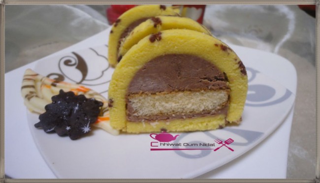 buche imprimée, imprimee, cake roulé, roulee, génoise, cigarette, pate, chocolat, cacao, crèma patissière, creme, poudre amande, biscuit jocande, boudoires, recette, cuisine marocaine, bonne année, nouvelle année, chhiwate cuisine oum nidal, كيك ملفوف, رولي, وصفة, كاطو, جينوازو جينواز, لوز, شهيوات مغربية, حلويات, أطباق حلوة, كريمة حلوانية, مطبخ أم نضال, شوكولا, كاكاو, رأس السنة