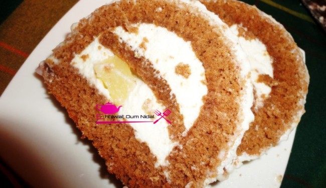 buche, creme poire, crème, cake roulee, gateau, nouvelle annee, bonne année, cuisine marocaine, recette, chocolat, cacao, cuisine oum nidal, génoise, genoise, sucree, anniversaire, fete, كيك ملفوف, رولي, رأس السنة, مناسبات, كاطو, حلوى, حلويات, شهيوات مغربية, وصفة, كريم الاجاص, كريمة, شوكولا, كاكاو, كيك مزين, أم نضال, جنواز, جينواز  
