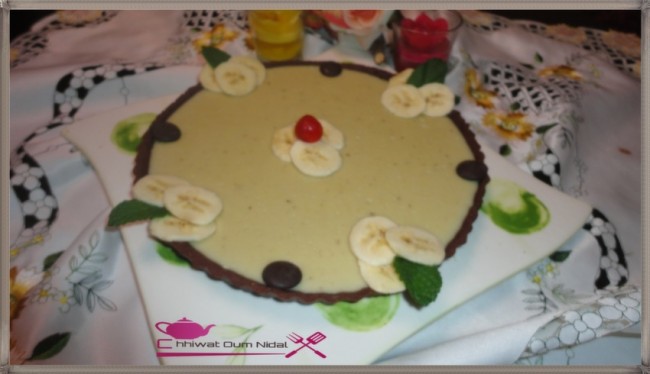 anniversaire, cacao, chhiwate, creme, crème banane, cuisine marocaine, cuisine oum nidal, tarte crème banane, fond de tarte, gateau, marron, om nidal, oum nidal, pate chocolat, pate tarte chocolat, petite tarte, recette, sucree, tartelette, أطباق حلوة, أم نضال, ام نضال, حلوى, حلويات, شهيوات, شهيوات مغربية, طارت صغيرة, طارتوليت بكريم الموز, طورتات صغيرة, عجين الطارت بالشوكولا, عجينة, عيد ميلاد, كريم الشوكولا, كريما, كريمة, كريم البنان, محليات, مطبخ أم نضال