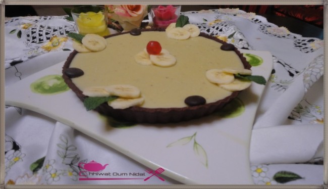 anniversaire, cacao, chhiwate, creme, crème banane, cuisine marocaine, cuisine oum nidal, tarte crème banane, fond de tarte, gateau, marron, om nidal, oum nidal, pate chocolat, pate tarte chocolat, petite tarte, recette, sucree, tartelette, أطباق حلوة, أم نضال, ام نضال, حلوى, حلويات, شهيوات, شهيوات مغربية, طارت صغيرة, طارتوليت بكريم الموز, طورتات صغيرة, عجين الطارت بالشوكولا, عجينة, عيد ميلاد, كريم الشوكولا, كريما, كريمة, كريم البنان, محليات, مطبخ أم نضال