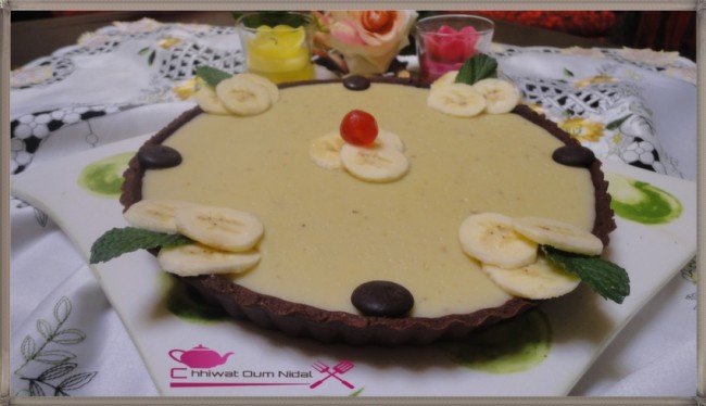 anniversaire, cacao, chhiwate, creme, crème banane, cuisine marocaine, cuisine oum nidal, tarte crème banane, fond de tarte, gateau, marron, om nidal, oum nidal, pate chocolat, pate tarte chocolat, petite tarte, recette, sucree, tartelette, أطباق حلوة, أم نضال, ام نضال, حلوى, حلويات, شهيوات, شهيوات مغربية, طارت صغيرة, طارتوليت بكريم الموز, طورتات صغيرة, عجين الطارت بالشوكولا, عجينة, عيد ميلاد, كريم الشوكولا, كريما, كريمة, كريم البنان, محليات, مطبخ أم نضال