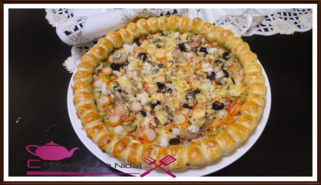 pizza etoile, pizza couronne, chhiwate, cuisine, sauce blanche, cuisine marocaine, cuisine oum nidal, cuisineoumnidal, jombon, pizza sauce tomate, pizza au thon, pizza au fruits de mer au sauce blanche, pate pizza, om nidal, pizza, recette, أم نضال, اطباق مالحة, ام نضال, بيتزا, شهيوات, شهيوات مغربية, صلصة الطماطم, عجينة, لحم مدخن, بيتزا فواكه البحر بالصلصة البيضاء, بيتزا بالطون, بيتزا بصلصة الطماطم, بيتزا مالحة, بيتزا على شكل تاج, بيتزا على شكل تاج, عجين البيتزا, صلصة بيضاء, عجينة البيتزا, مطبخ أم نضال, مملحات, وصفة